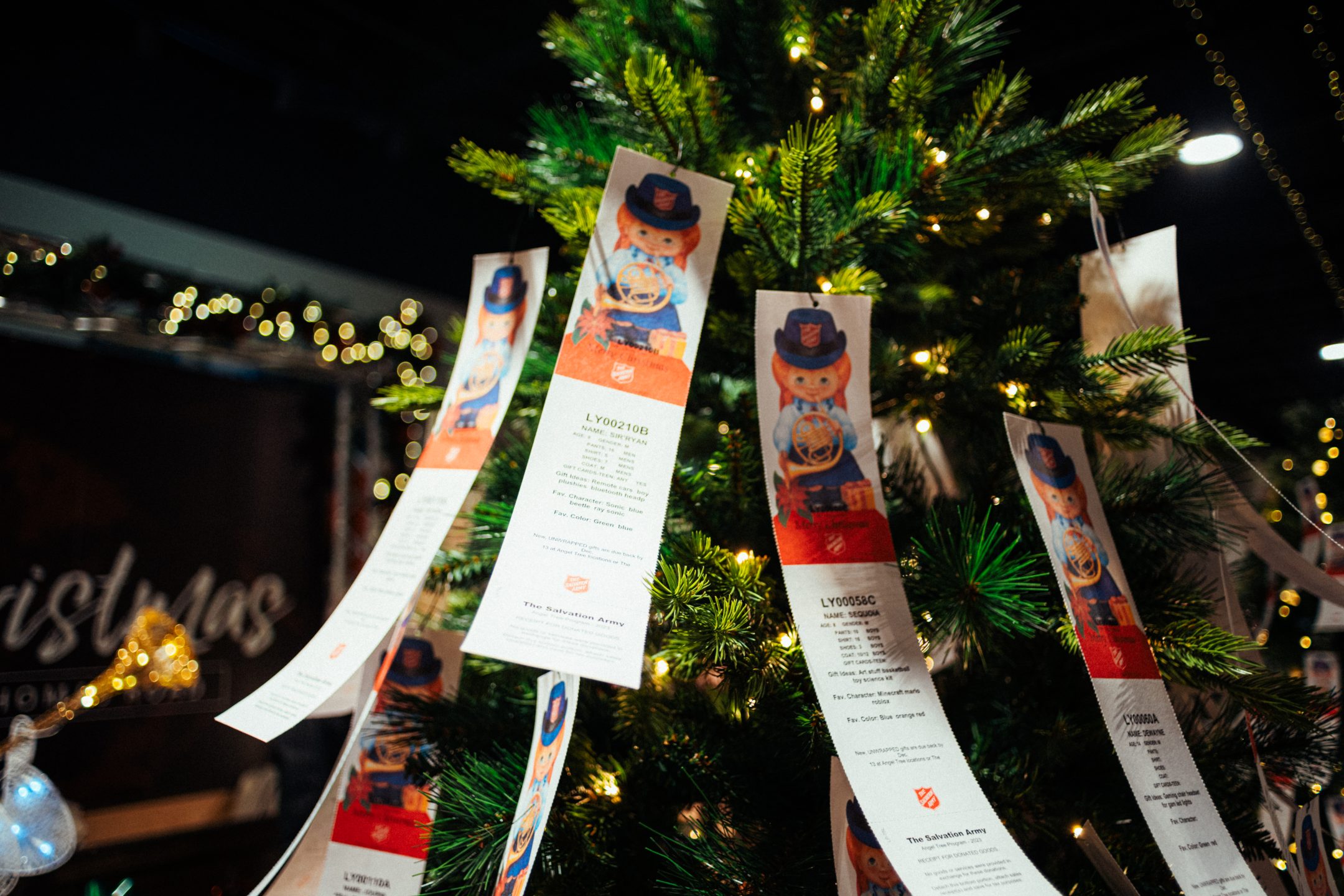 Angel Tree tags hanging on Christmas tree